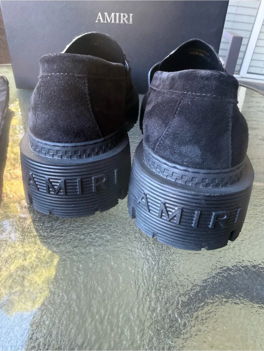 AMIRI Black Suede Tassel Loafers with Leopard Accent and Gold Crest